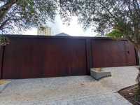 Casa do Corten - Porta pivotante em Aço Corten Whats